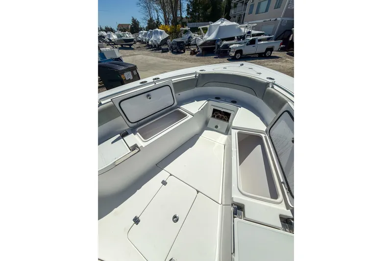 Slide: The Image of 2019 Sportsman Open 282 Center Console boat with open storage compartments. - 9