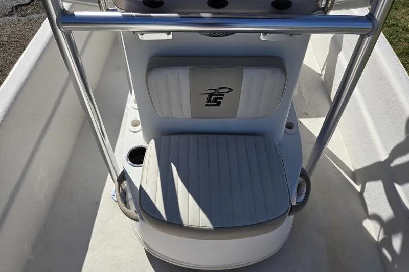 Slide: The Image of 2017 Carolina Skiff 19 DLX boat seat with logo and cup holder. - 10