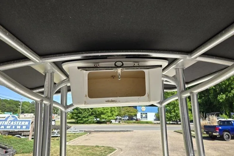 Slide: The Image of 2017 Carolina Skiff 19 DLX T-top frame with storage compartment. - 11