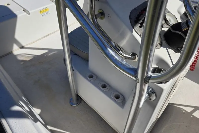 Slide: The Image of 2017 Carolina Skiff 19 DLX boat interior with metal railings and control panel. - 17