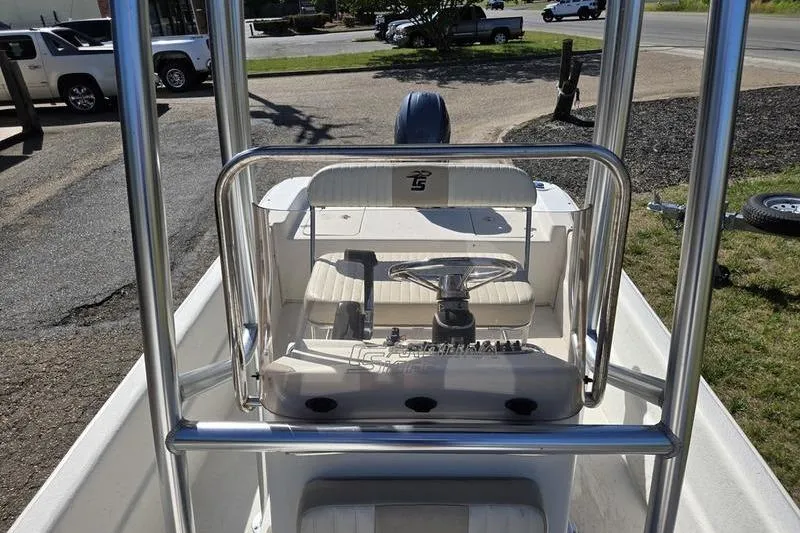 Slide: The Image of 2017 Carolina Skiff 19 DLX boat console with steering wheel and seating. - 18