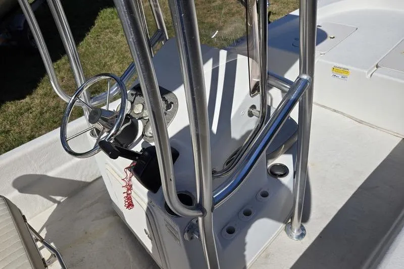 Slide: The Image of 2017 Carolina Skiff 19 DLX boat console with steering wheel and controls. - 5