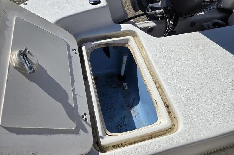 Slide: The Image of Open storage compartment on a 2017 Carolina Skiff 19 DLX boat. - 8