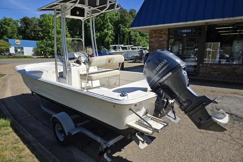 Slide: The Image of 2017 Carolina Skiff 19 DLX boat with Yamaha outboard motor on trailer. - 9