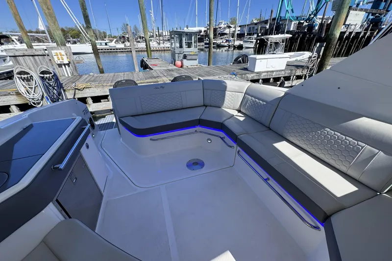 Slide: The Image of Luxurious seating area on a 2021 Sea Ray Sundancer 320 yacht at a marina. - 4