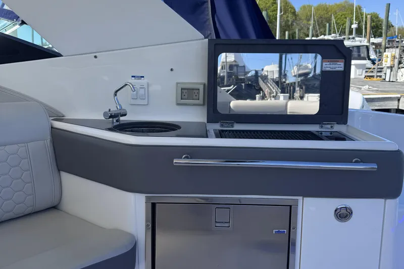Slide: The Image of Outdoor kitchenette on 2021 Sea Ray Sundancer 320 yacht with sink and grill. - 6