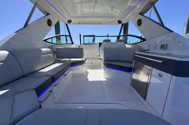 Slide: The Image of 2021 Sea Ray Sundancer 320 interior with modern seating and sleek design. - 7