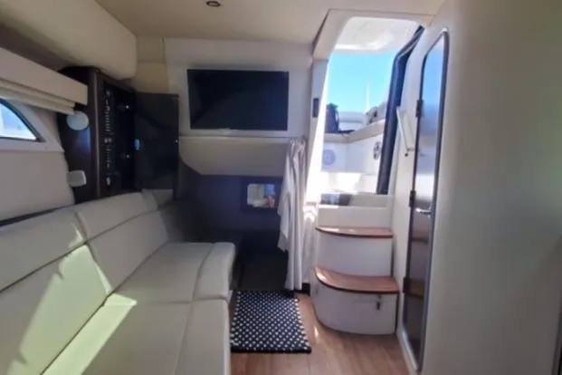 Slide: The Image of Interior of 2016 Regal 35 Sport Coupe with modern seating and entertainment system. - 10