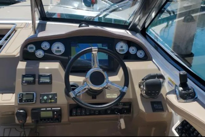 Slide: The Image of Cockpit of 2016 Regal 35 Sport Coupe with steering wheel and control panel. - 5