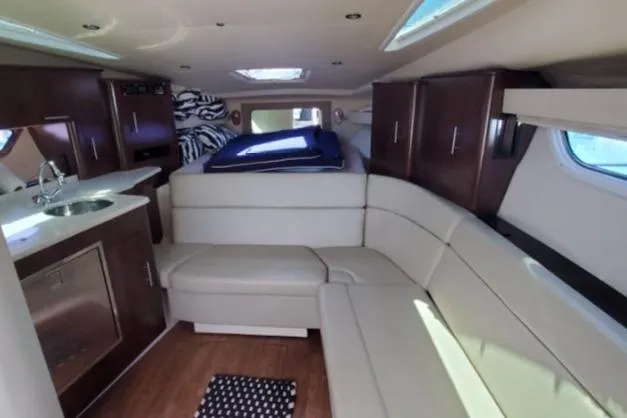 Slide: The Image of Interior of 2016 Regal 35 Sport Coupe with modern seating and kitchenette. - 9