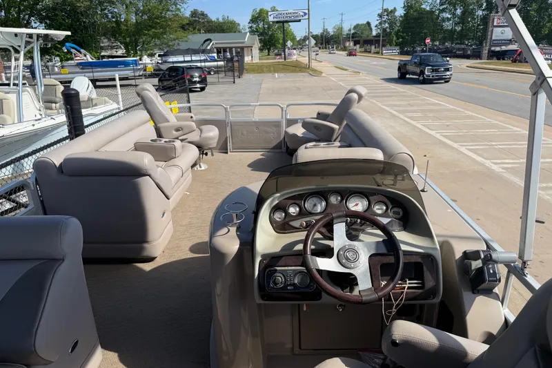Slide: The Image of 2008 Premier 250 Escapade pontoon boat with spacious seating and steering console. - 11