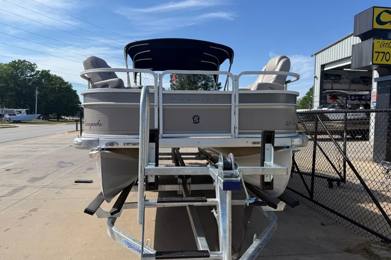 Slide: The Image of 2008 Premier 250 Escapade pontoon boat on trailer, parked outdoors near a dealership. - 3
