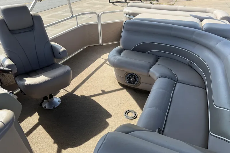 Slide: The Image of Interior of 2008 Premier 250 Escapade boat with gray seating and captain's chair. - 8