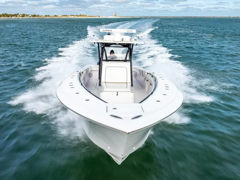 Slide: The Image of 2020 SeaHunter 35 Tournament boat cruising on open water. - 16