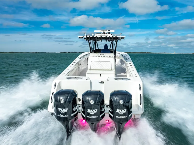 Slide: The Image of 2020 SeaHunter 35 Tournament boat with triple Yamaha 300 engines on the water. - 17