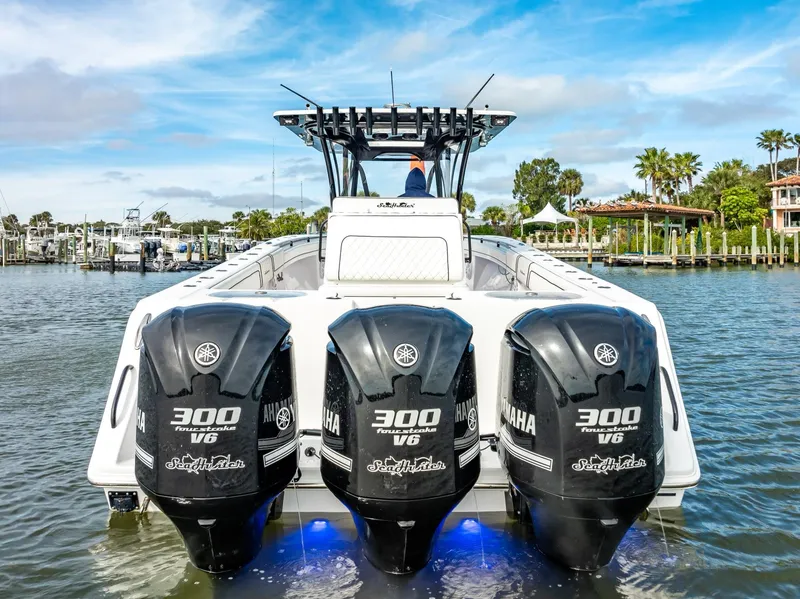 Slide: The Image of 2020 SeaHunter 35 Tournament boat with triple Yamaha 300 V6 engines on water. - 21