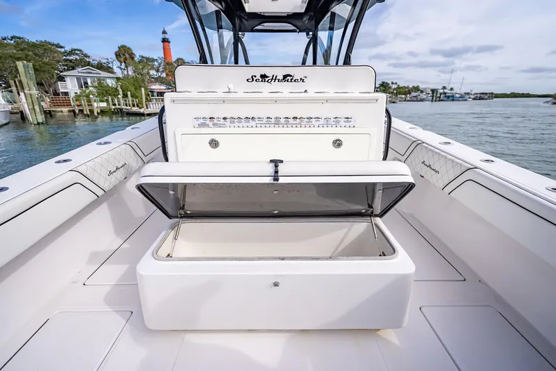 Slide: The Image of 2020 SeaHunter 35 Tournament boat with open storage compartment on deck. - 42