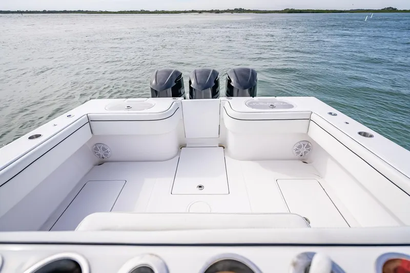 Slide: The Image of 2020 SeaHunter 35 Tournament boat with triple outboard motors on the water. - 44