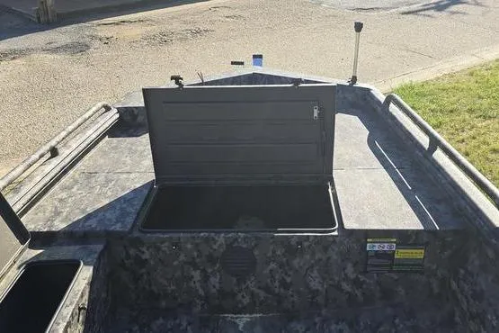 Slide: The Image of 2026 Havoc 1860 DBST boat with open storage compartment, camo design. - 11