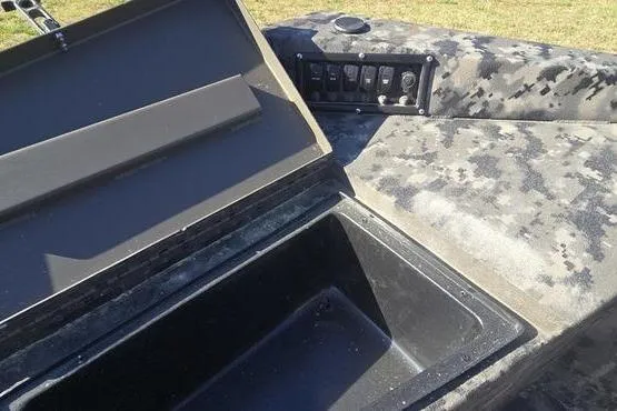 Slide: The Image of Open storage compartment in 2026 Havoc 1860 DBST boat with control panel. - 4