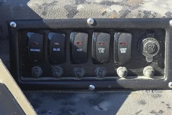 Slide: The Image of Control panel of 2026 Havoc 1860 DBST boat with labeled switches and 12V outlet. - 6