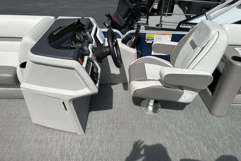 Slide: The Image of Captain's chair and helm of 2022 Godfrey Xperience 2286 SBX pontoon boat. - 3