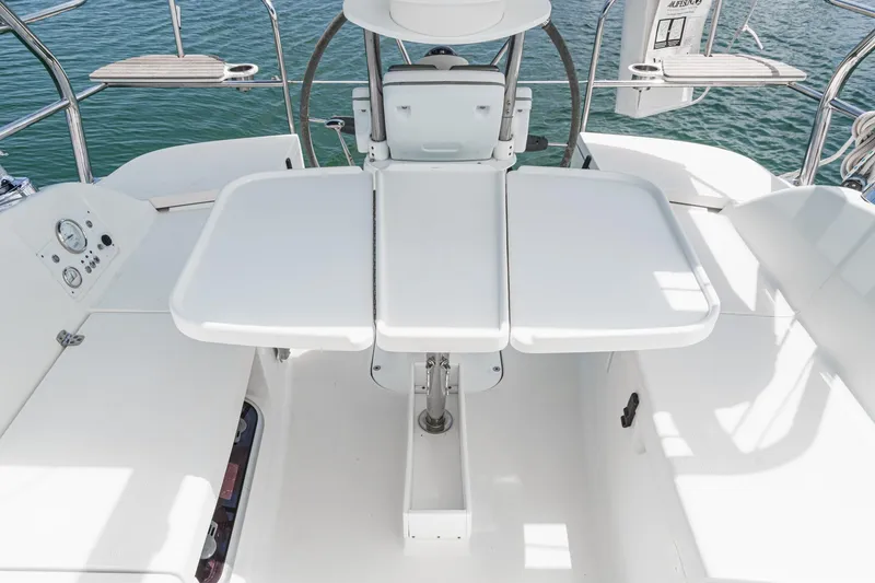 Slide: The Image of Cockpit of 2015 Hunter 33 sailboat with foldable table and seating. - 3