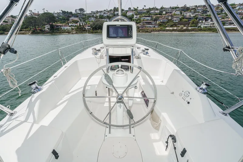 Slide: The Image of Cockpit view of 2015 Hunter 33 sailboat with steering wheel and navigation system. - 6
