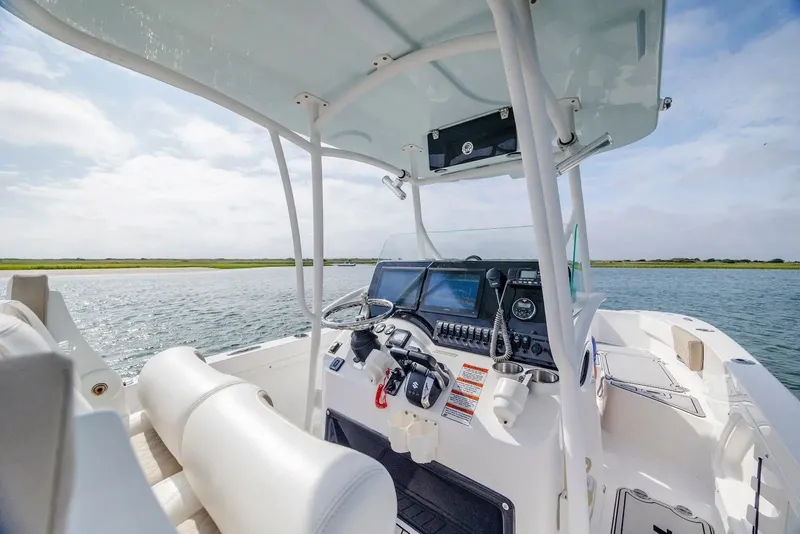 Slide: The Image of Interior view of 2023 Twin Vee 240 GFX boat on the water. - 13