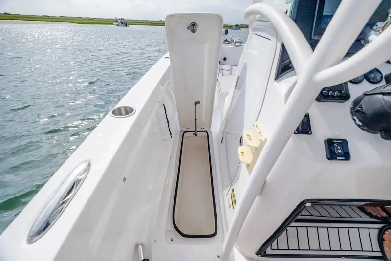 Slide: The Image of Interior view of 2023 Twin Vee 240 GFX boat on the water. - 20