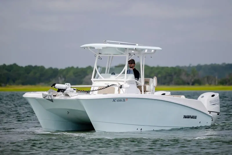 Slide: The Image of 2023 Twin Vee 240 GFX boat on calm water. - 3