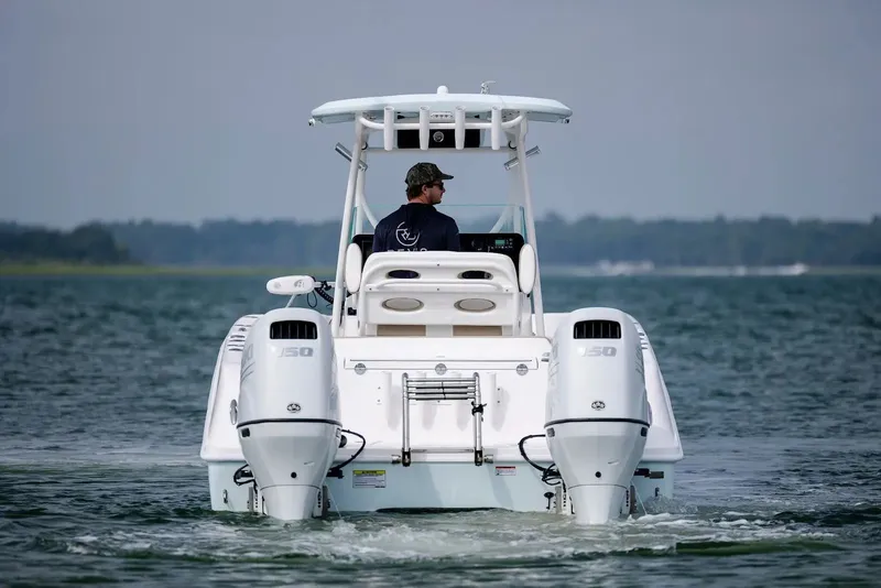 Slide: The Image of 2023 Twin Vee 240 GFX boat on water with dual engines. - 7