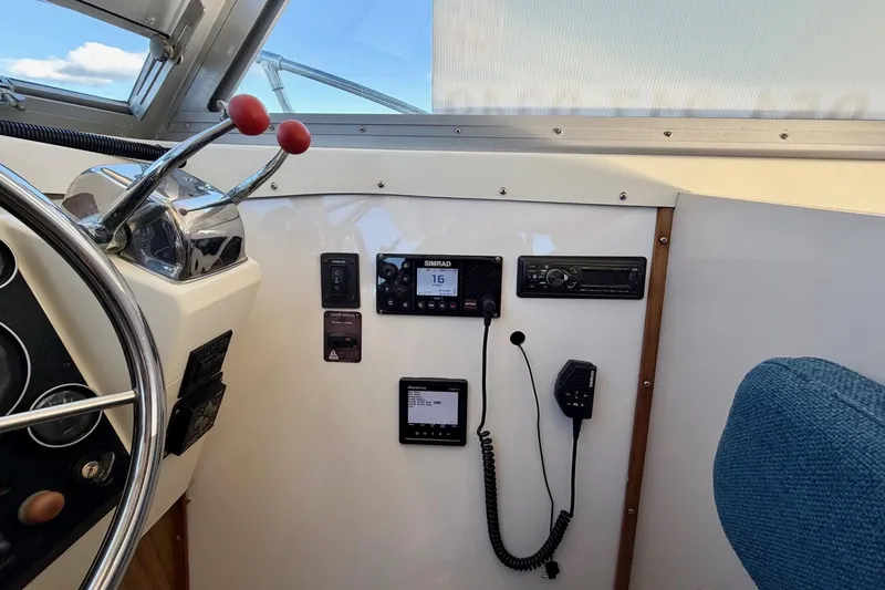 Slide: The Image of Interior helm of 1981 Bertram 28 Flybridge Cruiser with navigation equipment and controls. - 18