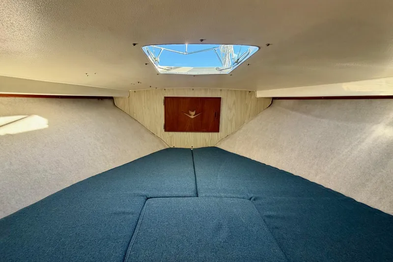 Slide: The Image of Interior cabin of 1981 Bertram 28 Flybridge Cruiser with blue upholstery. - 23