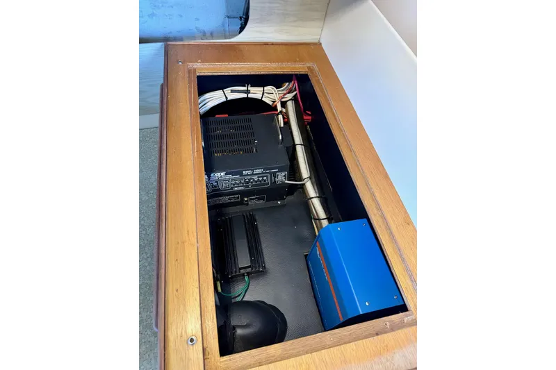 Slide: The Image of Electrical components inside a 1981 Bertram 28 Flybridge Cruiser, featuring wiring and equipment. - 6