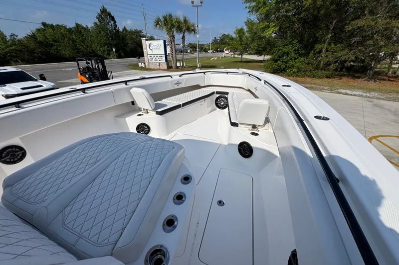 Slide: The Image of 2024 Fountain Bluewater 38 Tournament Edition boat interior with seating and speakers. - 14