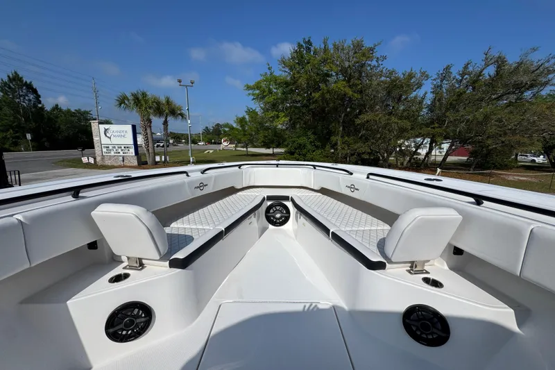 Slide: The Image of 2024 Fountain Bluewater 38 Tournament Edition boat interior with seating and speakers. - 15