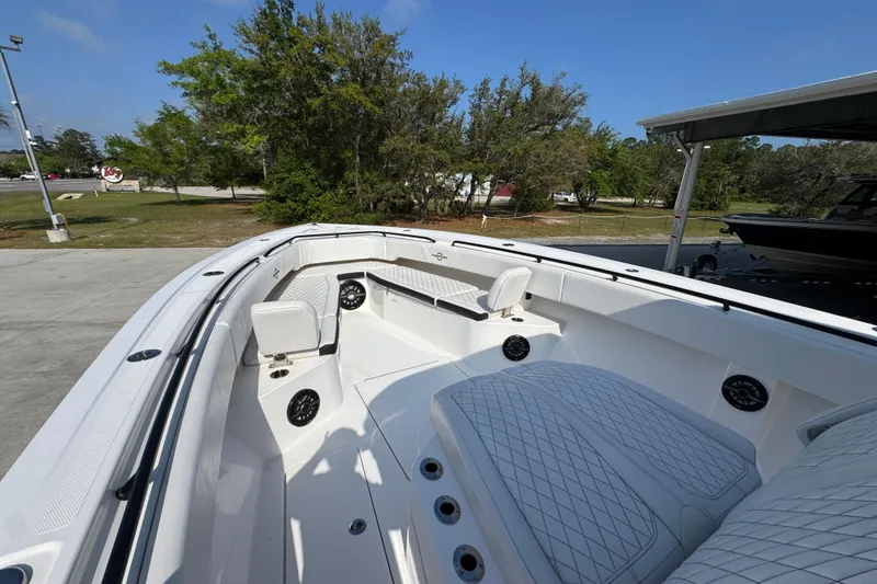 Slide: The Image of 2024 Fountain Bluewater 38 Tournament Edition boat interior with seating and speakers. - 16