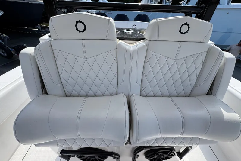 Slide: The Image of Luxurious seating on 2024 Fountain Bluewater 38 Tournament Edition boat, featuring diamond-stitched upholstery. - 24