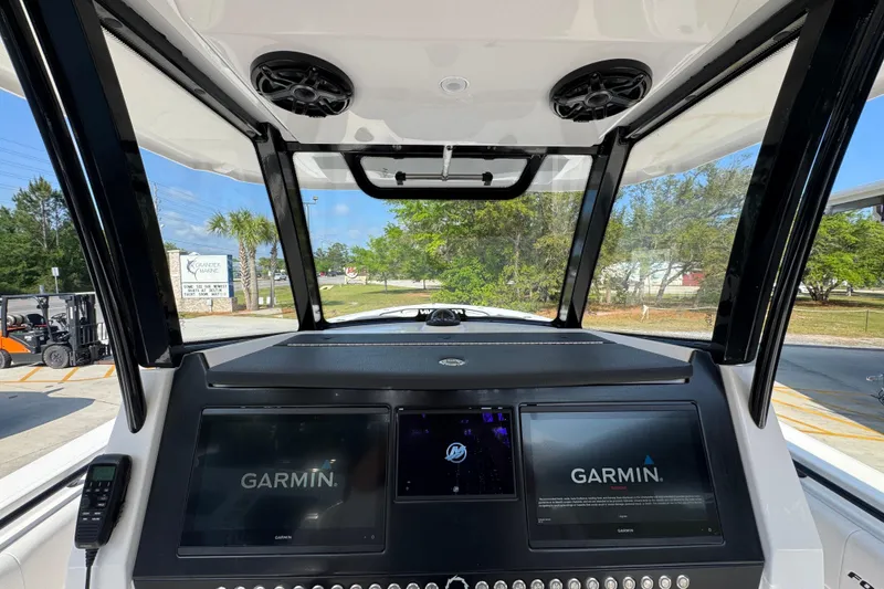 Slide: The Image of 2024 Fountain Bluewater 38 Tournament Edition dashboard with dual Garmin displays. - 29