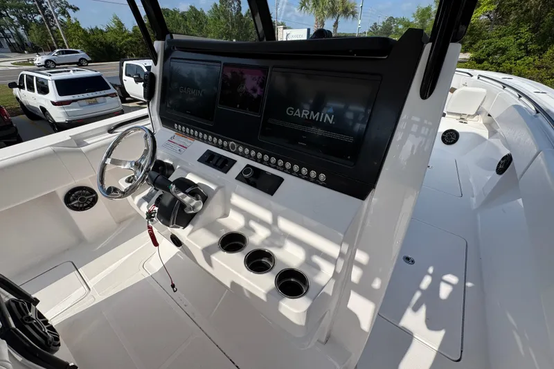 Slide: The Image of 2024 Fountain Bluewater 38 Tournament Edition boat cockpit with Garmin navigation system. - 30