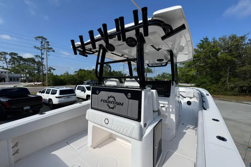 Slide: The Image of 2024 Fountain Bluewater 38 Tournament Edition boat with rod holders and sleek design. - 33