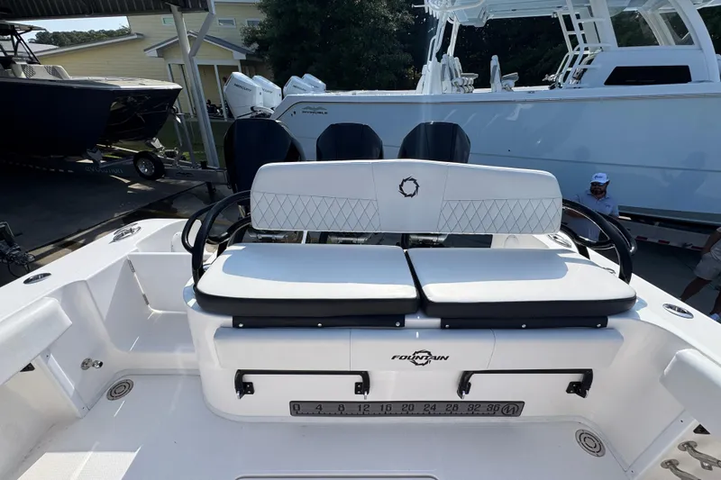 Slide: The Image of 2024 Fountain Bluewater 38 Tournament Edition boat with cushioned seating and sleek design. - 35
