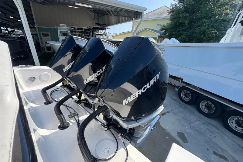Slide: The Image of Triple Mercury outboard engines on 2024 Fountain Bluewater 38 Tournament Edition boat. - 37