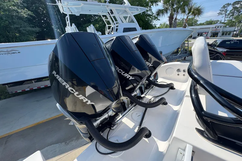 Slide: The Image of 2024 Fountain Bluewater 38 Tournament Edition with triple Mercury outboard engines. - 38