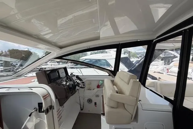 Slide: The Image of 2016 Cruisers Yachts 390 Express Coupe cockpit with modern helm and seating. - 13