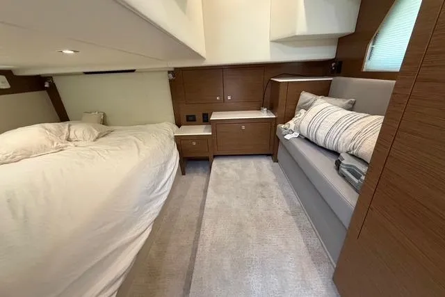 Slide: The Image of Luxurious 2016 Cruisers Yachts 390 Express Coupe cabin with modern wood finish and cozy bedding. - 23