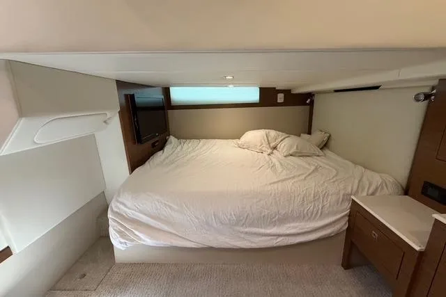 Slide: The Image of Luxurious cabin interior of 2016 Cruisers Yachts 390 Express Coupe with cozy bed. - 24
