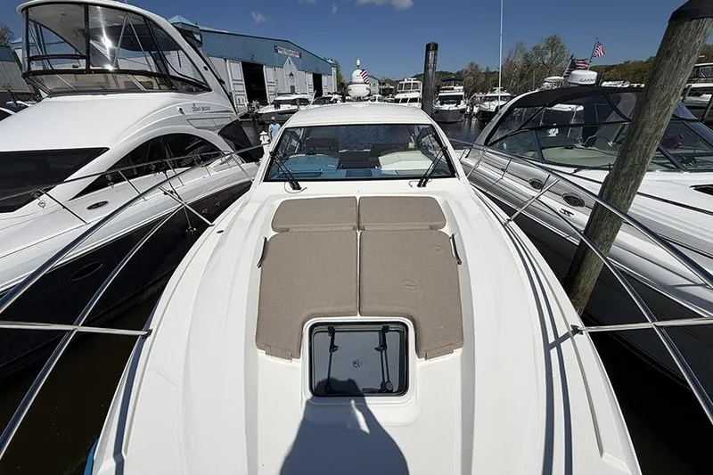 Slide: The Image of 2016 Cruisers Yachts 390 Express Coupe docked among other boats at a marina. - 27