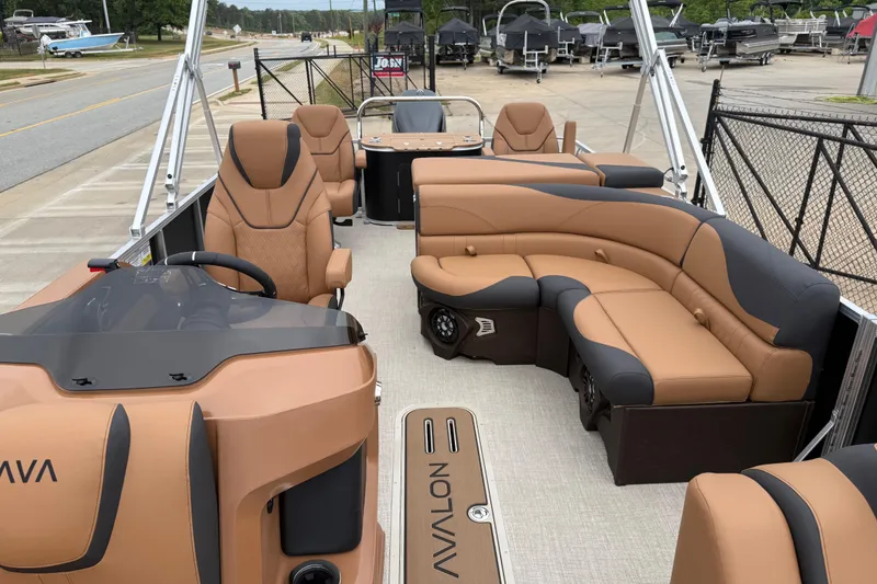 Slide: The Image of 2026 Avalon LSZ Rear Fish pontoon boat with luxurious tan seating and modern design. - 10